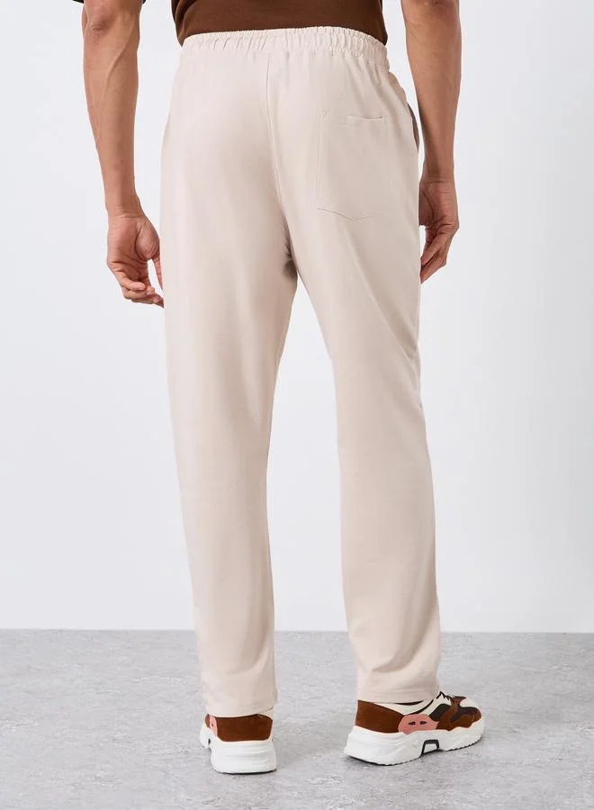 Styli  Men Beige Solid Straight Fit Joggers for Men | Best Price UAE